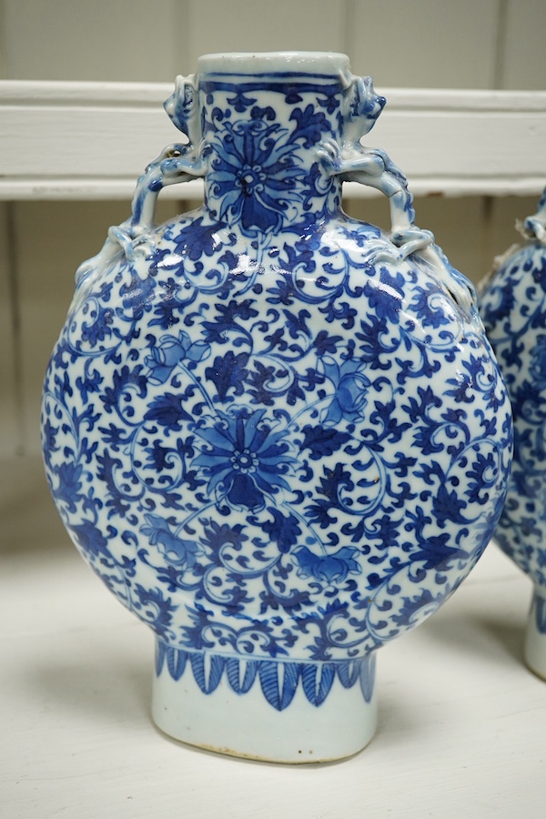 A pair of late 19th century Chinese blue and white moon vases, 23cm. Condition - one vase poor